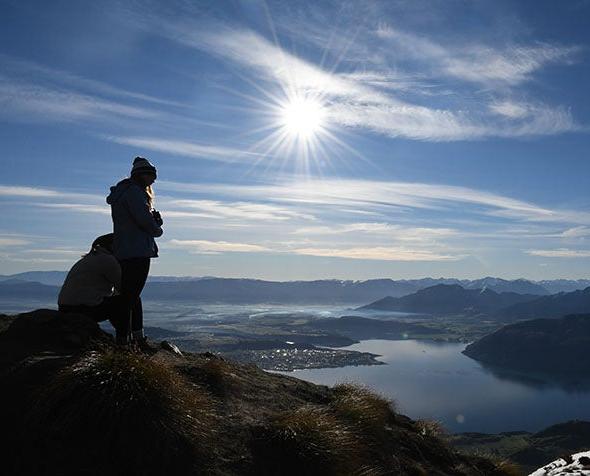 student looking over cliff